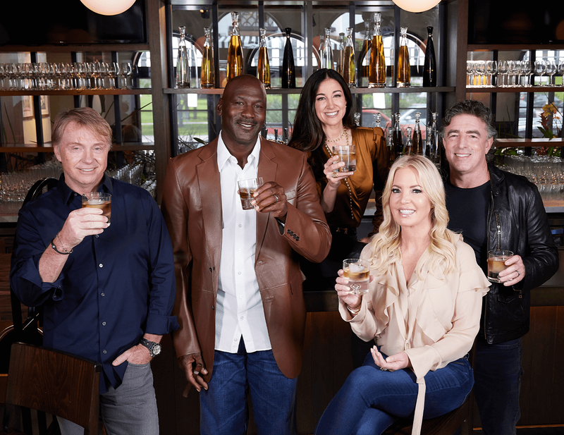 The Co-Founders of Cincoro Tequila (Jeanie Buss, Wes Edens, Michael Jordan and Wyc Grousbeck) share a drink of tequila with Emilia
